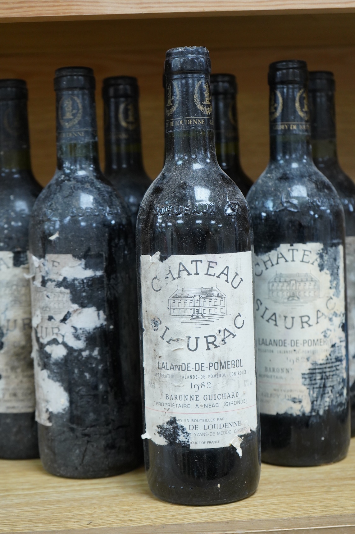 Eight bottles of Chateau Siaurac 1982, labels defective